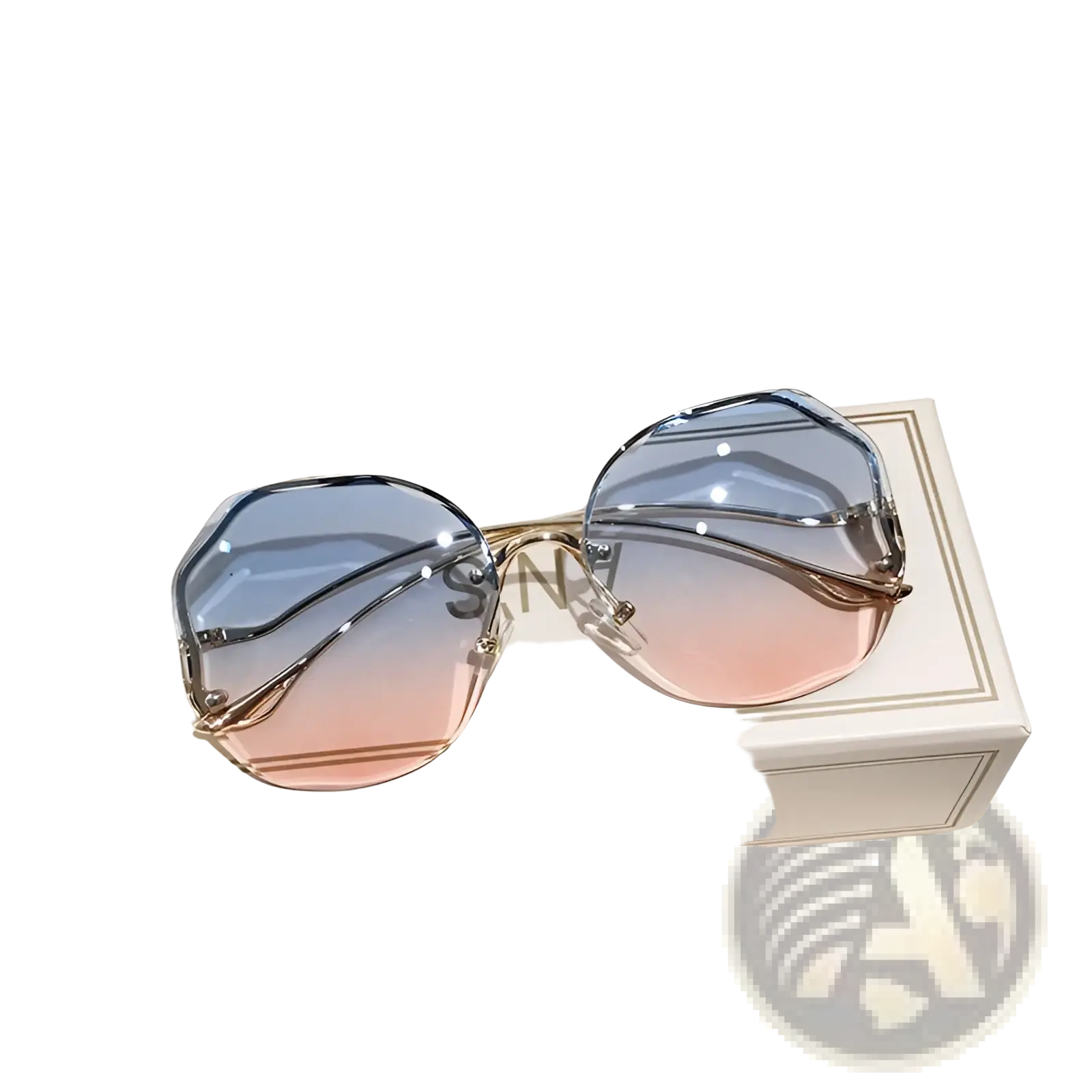 A pair of gradient oversized geometric metal frame sunglasses with blue to pink lenses on its branded box
