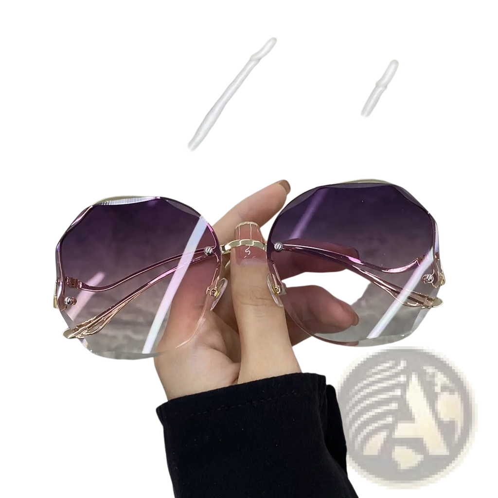 A pair of oversized geometric sunglasses with gradient purple lenses and gold-toned metal frames
