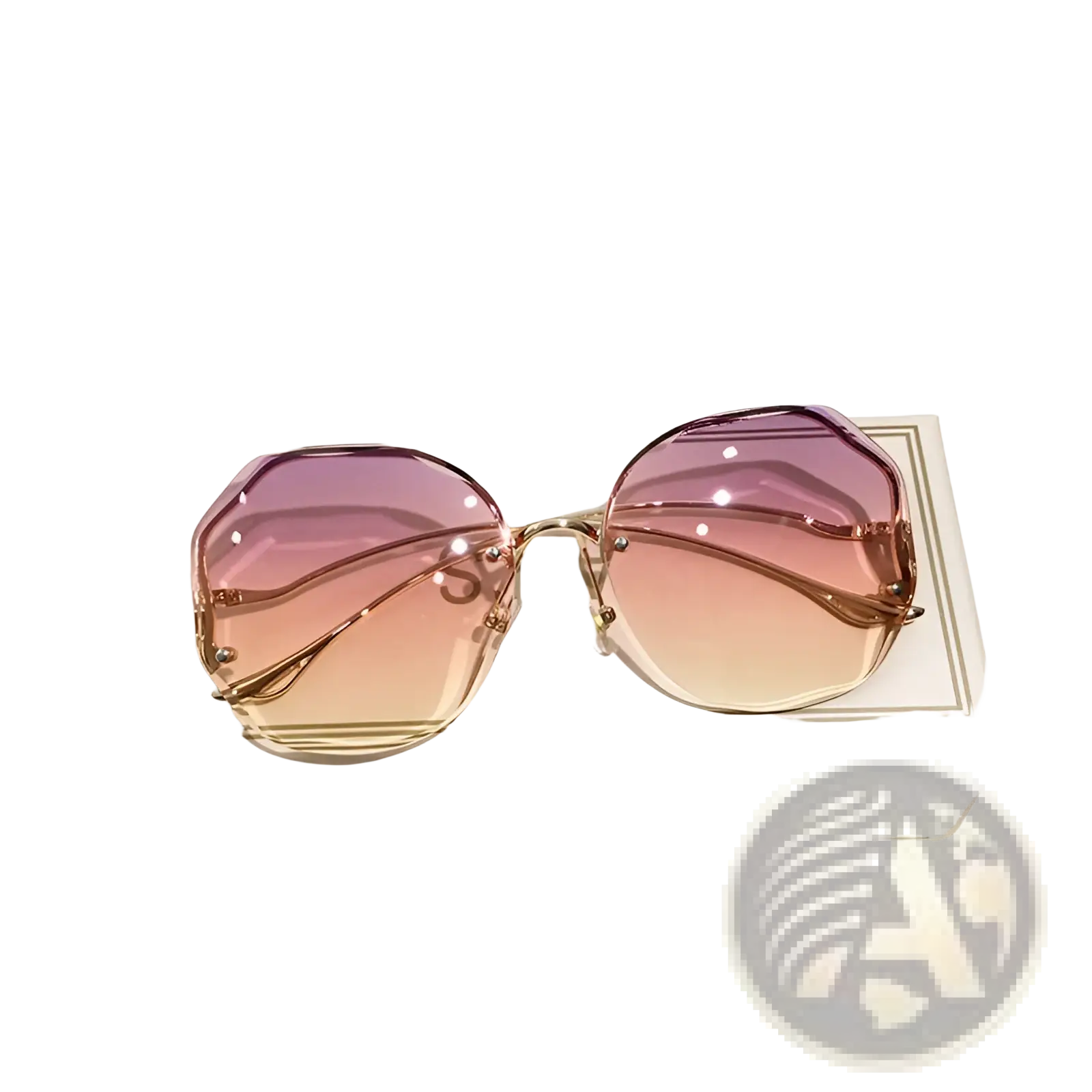 A pair of gradient oversized geometric sunglasses with pink-to-orange lenses and gold-toned metal frames