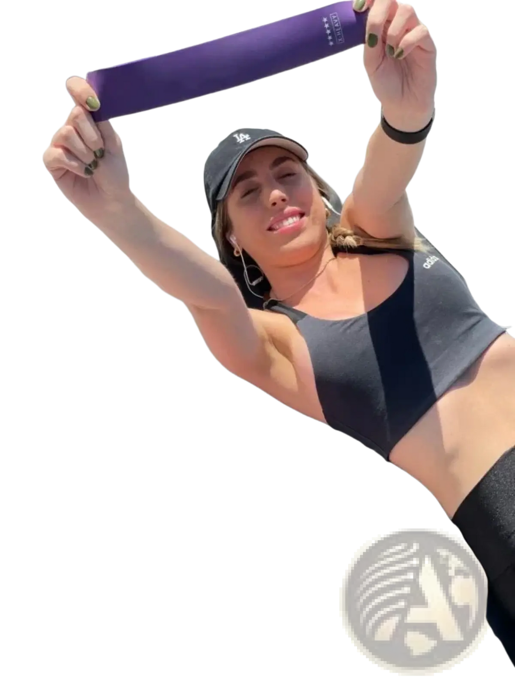 Gradient resistance bands set showing purple band held in hands with pink and orange bands laid out for workout use