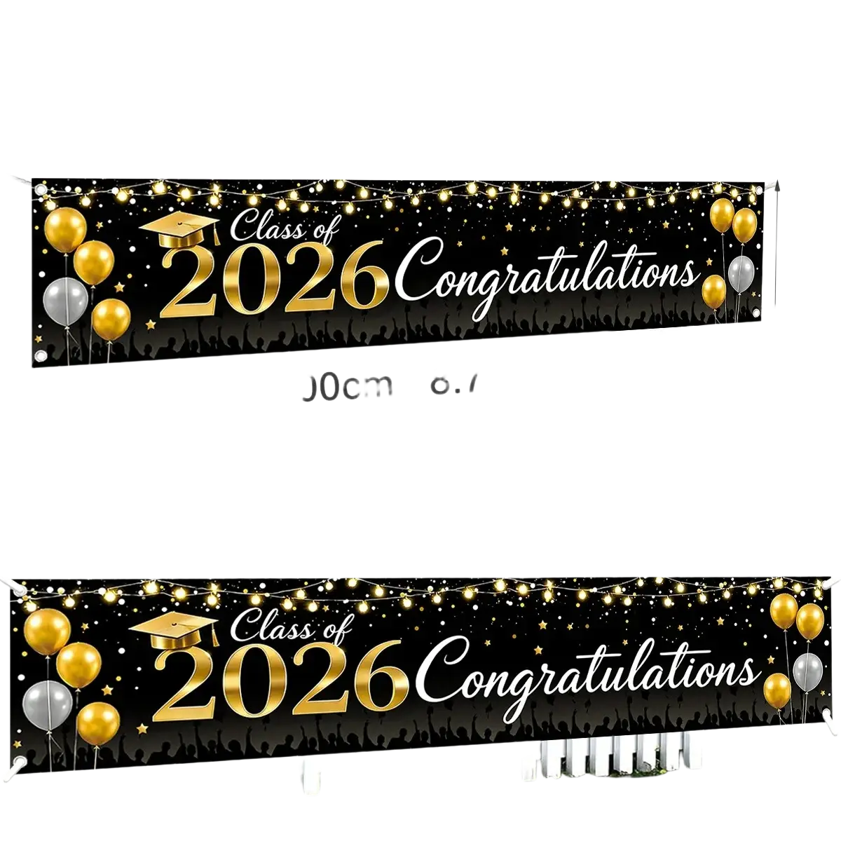 Black polyester graduation banner class of 2026 with gold and white text decorated with golden balloons and string lights