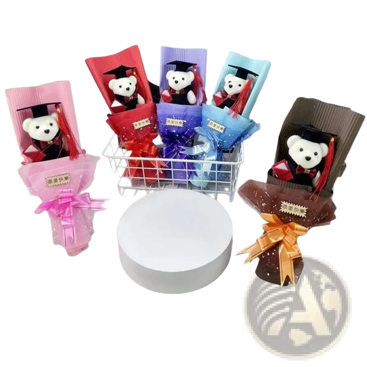 Adorable white plush graduation bears in black gowns with red tassels nestled in colorful paper-wrapped bouquets