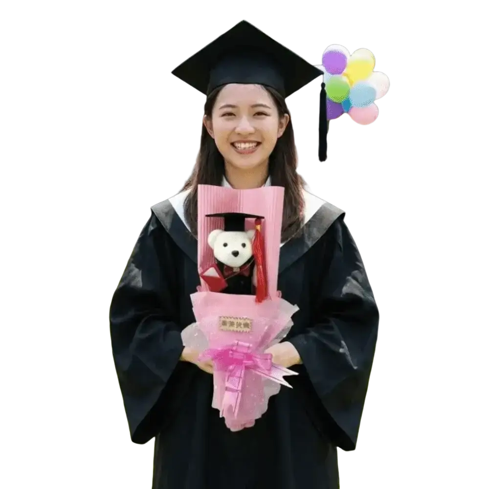 Black graduation cap and colorful balloons next to plush graduation bear bouquet gift for celebrating success