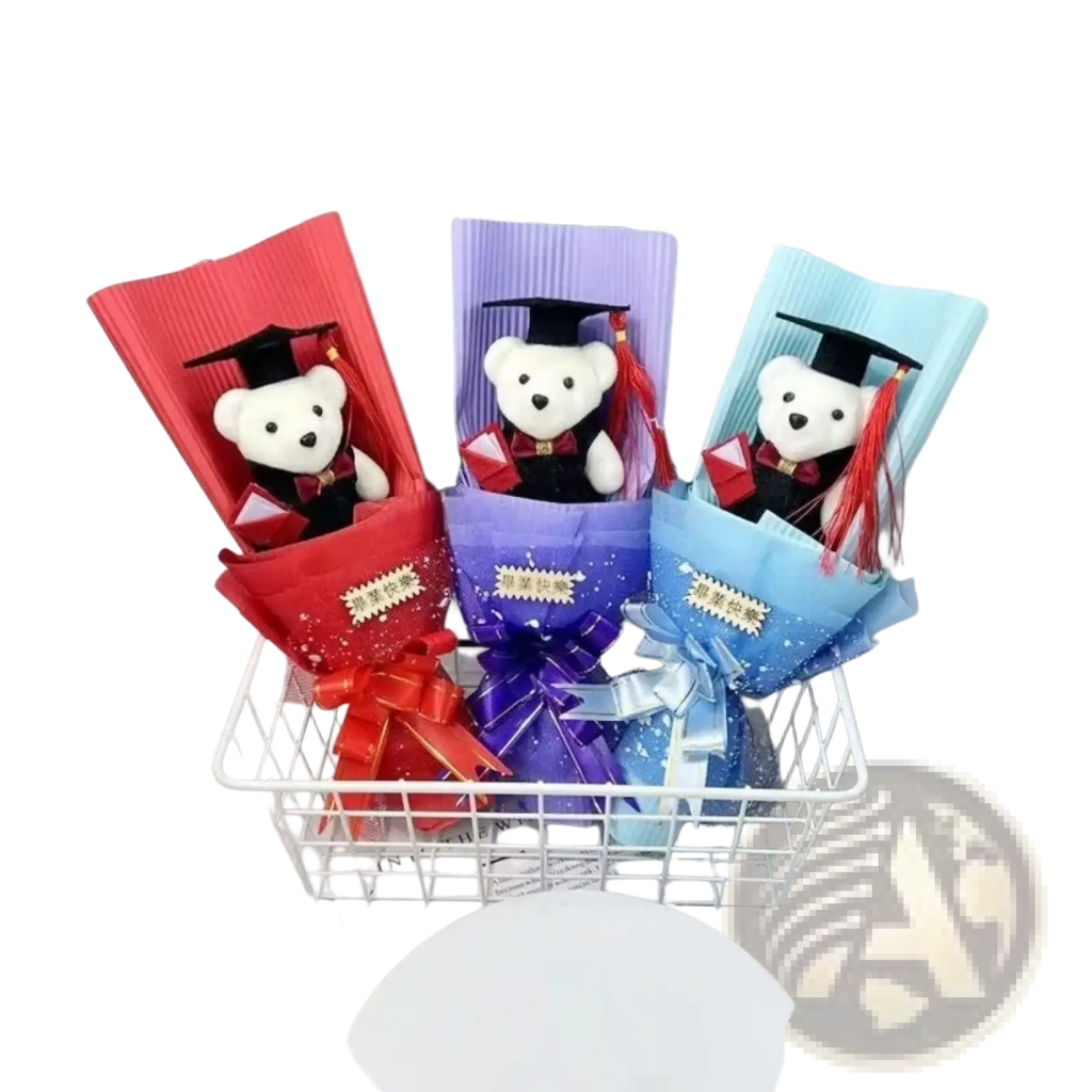 Three plush white bear graduation bouquets wrapped in colorful paper with bows and miniature cap and gown accessories