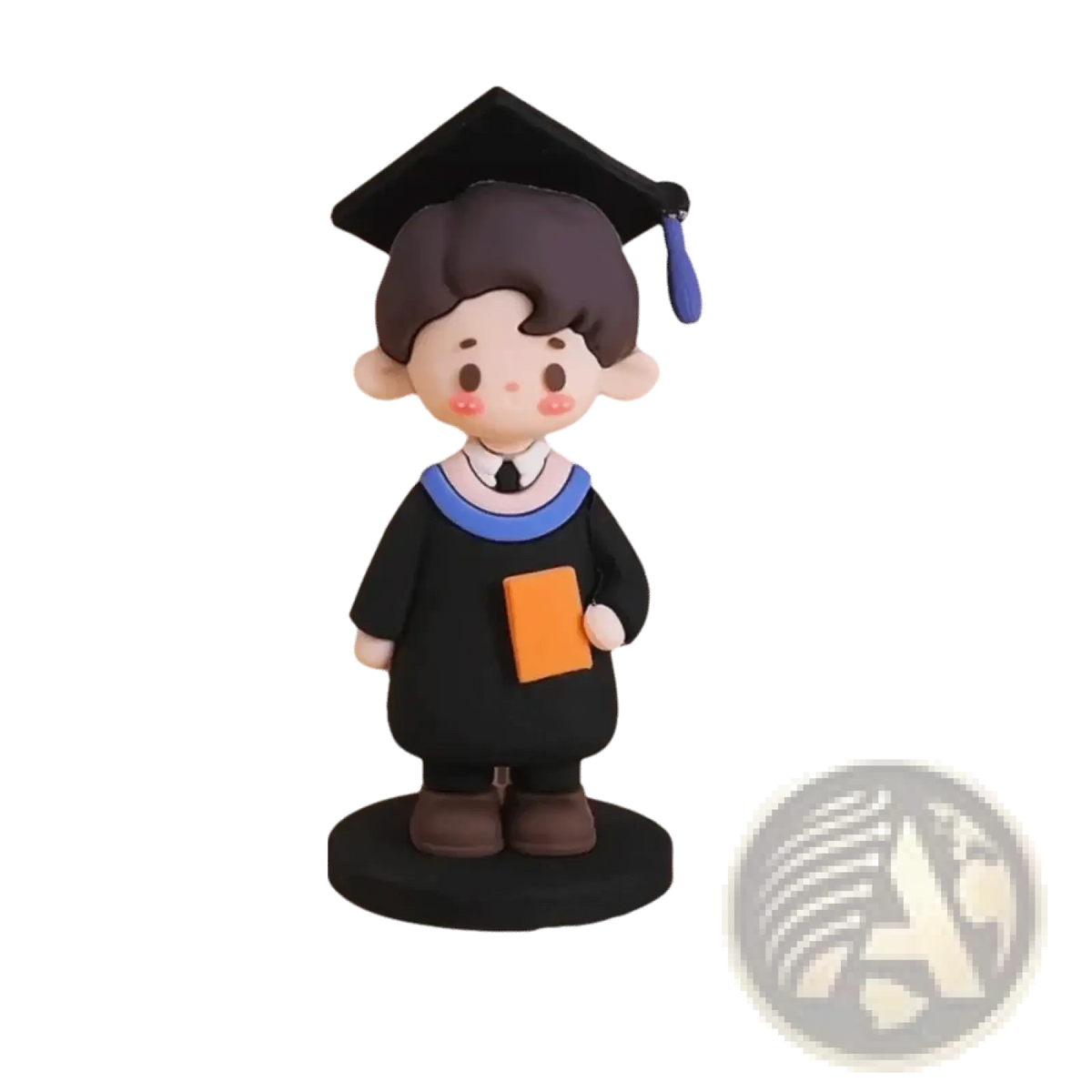 Graduation cake topper cute graduate figurine in black with brown hair blue trim and holding an orange book