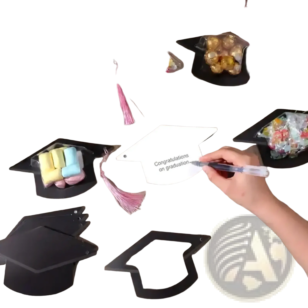 White graduation cap shaped paper card with congratulations on graduation printed in black ink for party favors