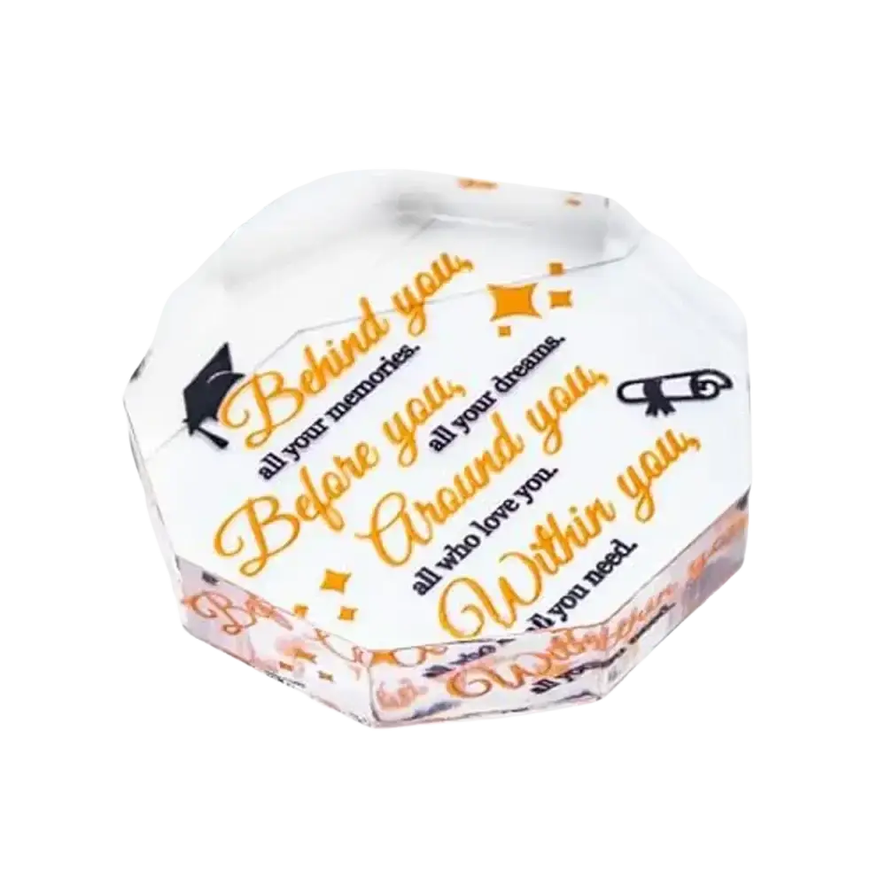 White octagonal acrylic keepsake box with gold and black graduation text and icons for desktop decor and graduation gift