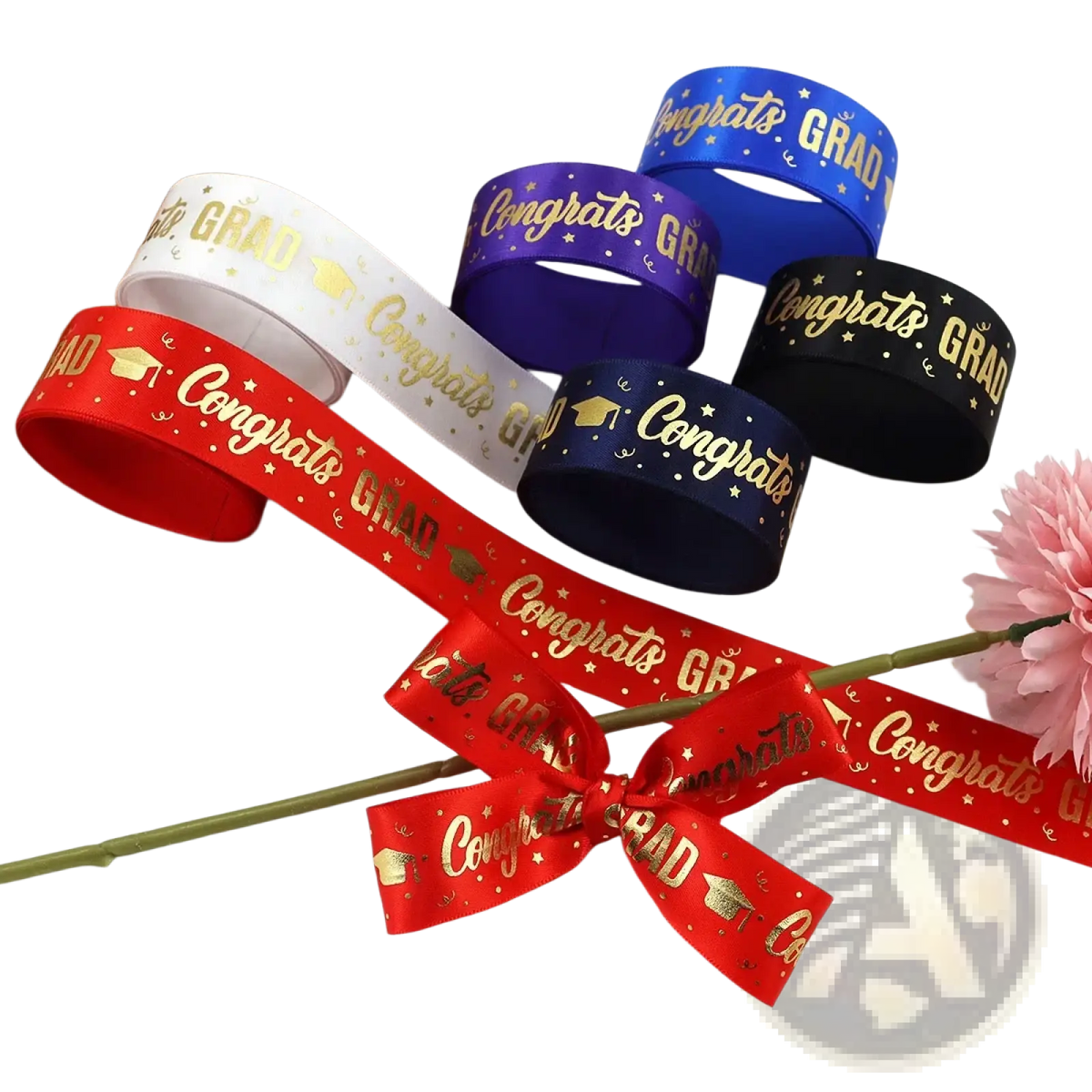 Red satin graduation gift wrapping ribbon featuring gold congrats grad text and cap motifs with small stars