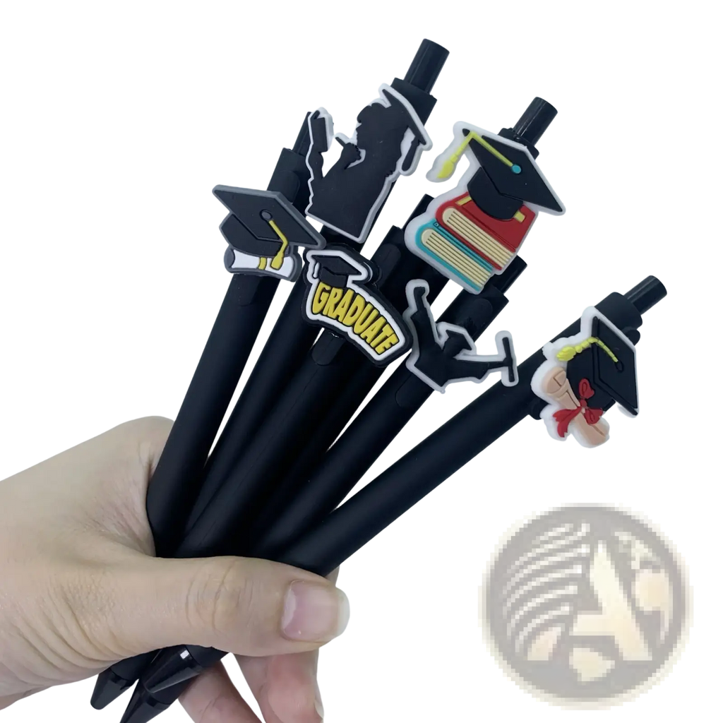 Black ballpoint pens with colorful silicone graduation charms featuring caps books and graduate for party favors