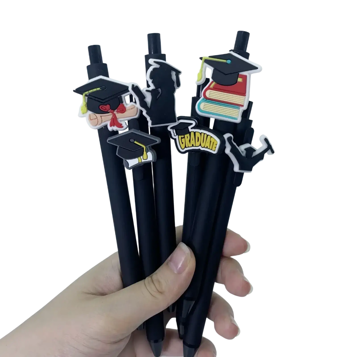 Black graduation pens bulk set with colorful rubber charms of caps books and graduate for party favors