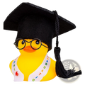Yellow rubber graduation rubber duck wearing a black cap with tassel, round glasses, and a happy graduation sash