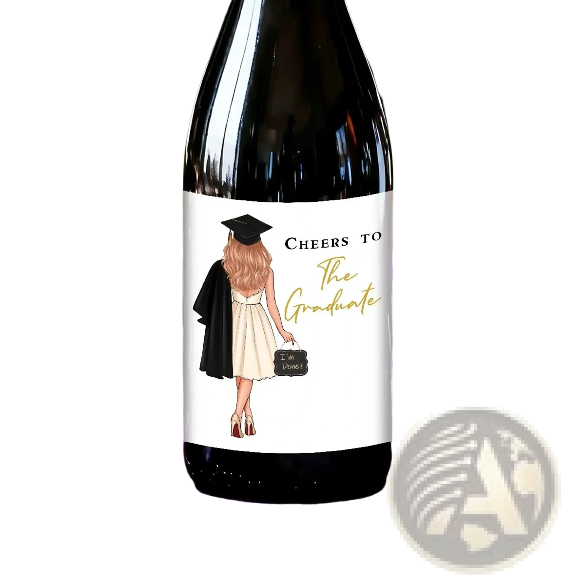 A dark glass wine bottle with a white graduation label showing a graduate holding a small chalkboard reading im done