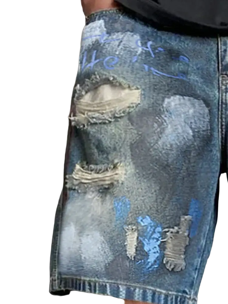 Graffiti distressed denim shorts men in blue featuring intentional rips faded patches and spray-painted graffiti-style markings