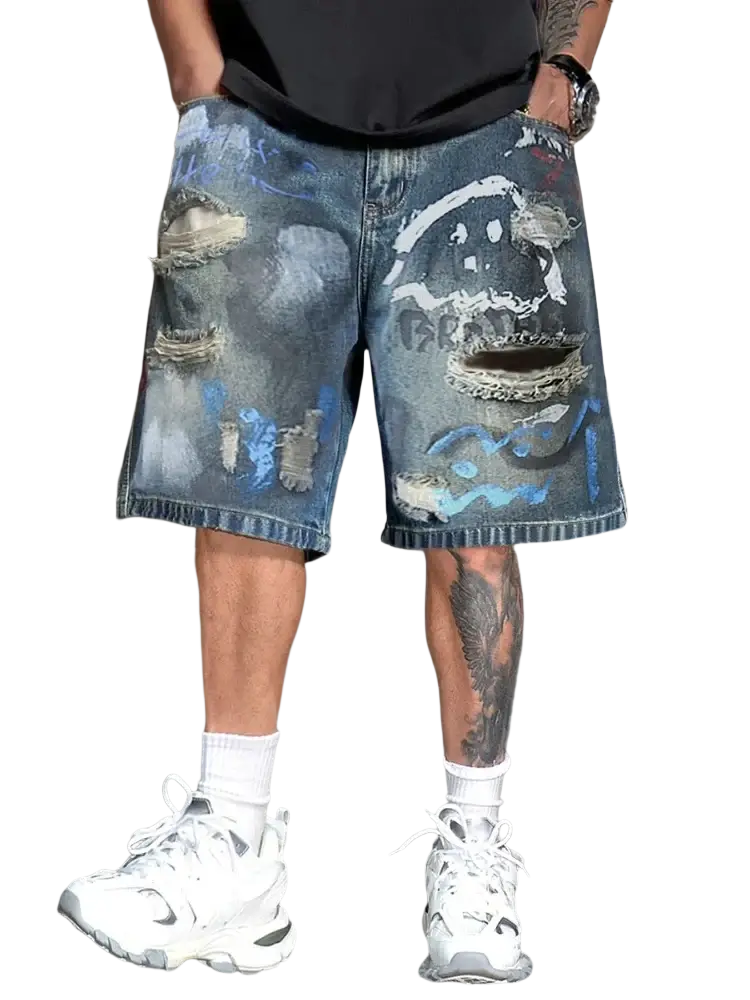 Distressed blue denim shorts for men with painted face design ripped details and faded wash Graffiti Distressed Denim Shorts