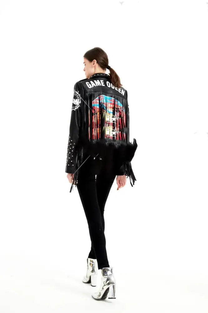 Back side of women’s black leather jacket with graffiti rivet studs fringe trim and colorful game queen graphic