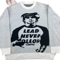 Gray knit sweater featuring a black knitted graphic of a person with sunglasses and lead never follow text in y2k streetwear style
