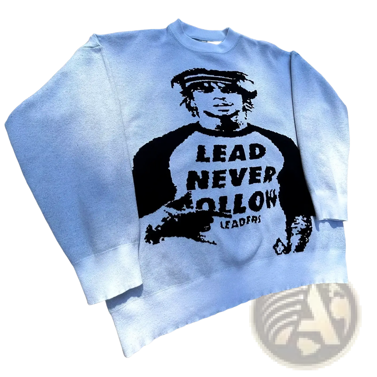Light gray knit crewneck sweater featuring a black graphic man with a headband and text lead never follow leaders