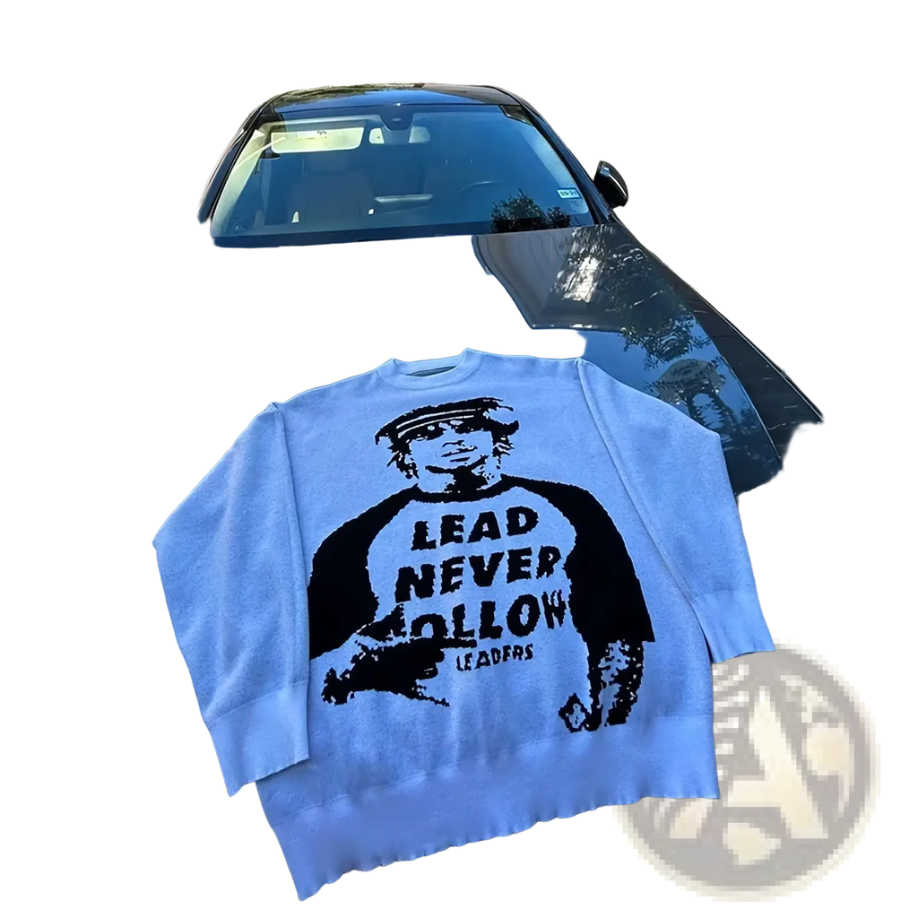 White knit graphic sweater with black man wearing cap and lead never follow leaders text y2k streetwear pullover