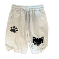 Light gray cotton sweat shorts for women with black pixelated cat and paw prints and silver star accents
