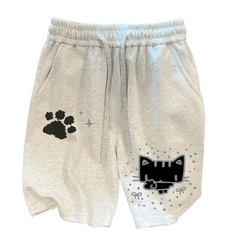 Light gray cotton sweat shorts for women with black pixelated cat and paw prints and silver star accents