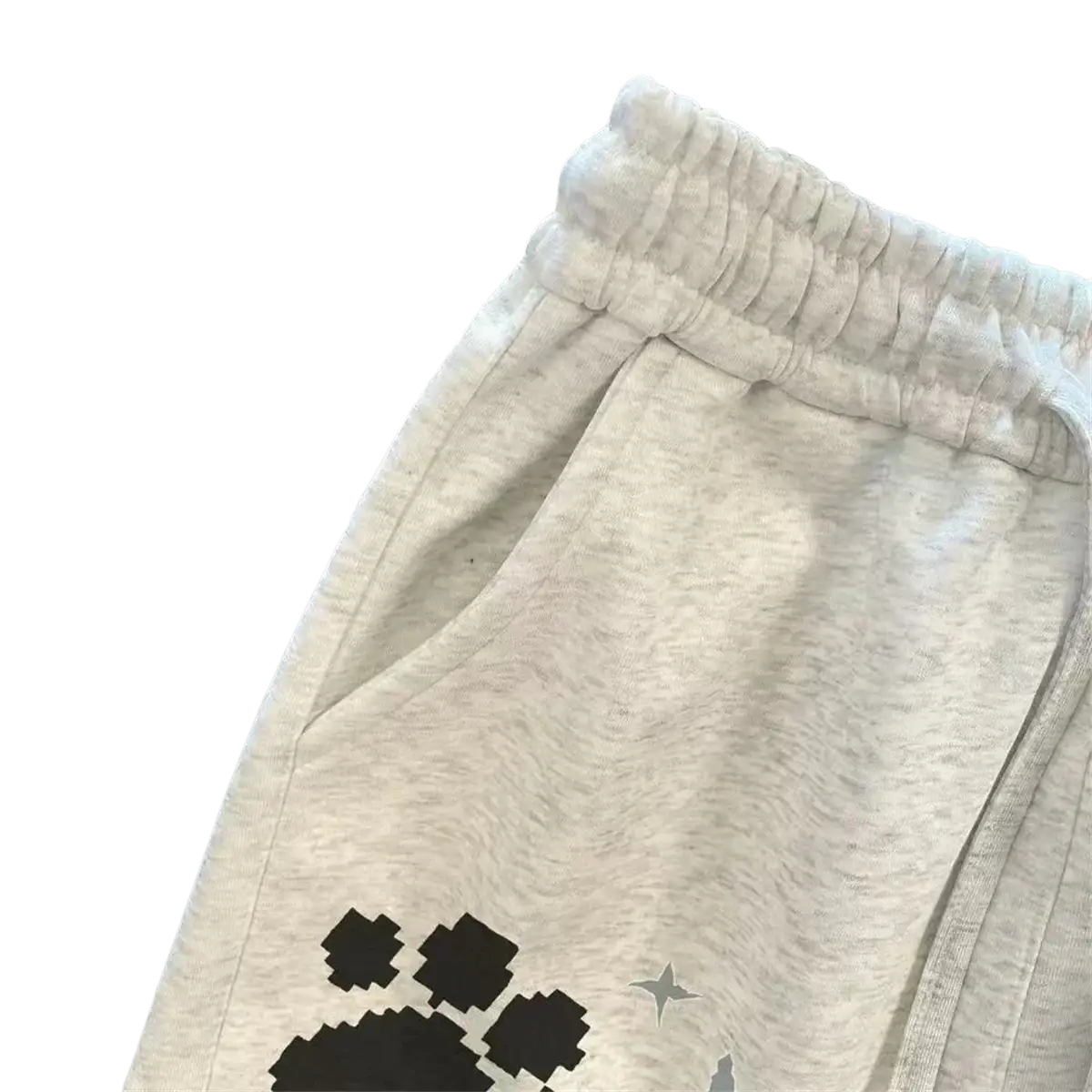 Light gray heathered sweatpants with black pixelated paw print and silver star graphic on the leg for women