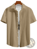 Beige short-sleeved button-up shirt with a textured diamond pattern suitable for casual wear
