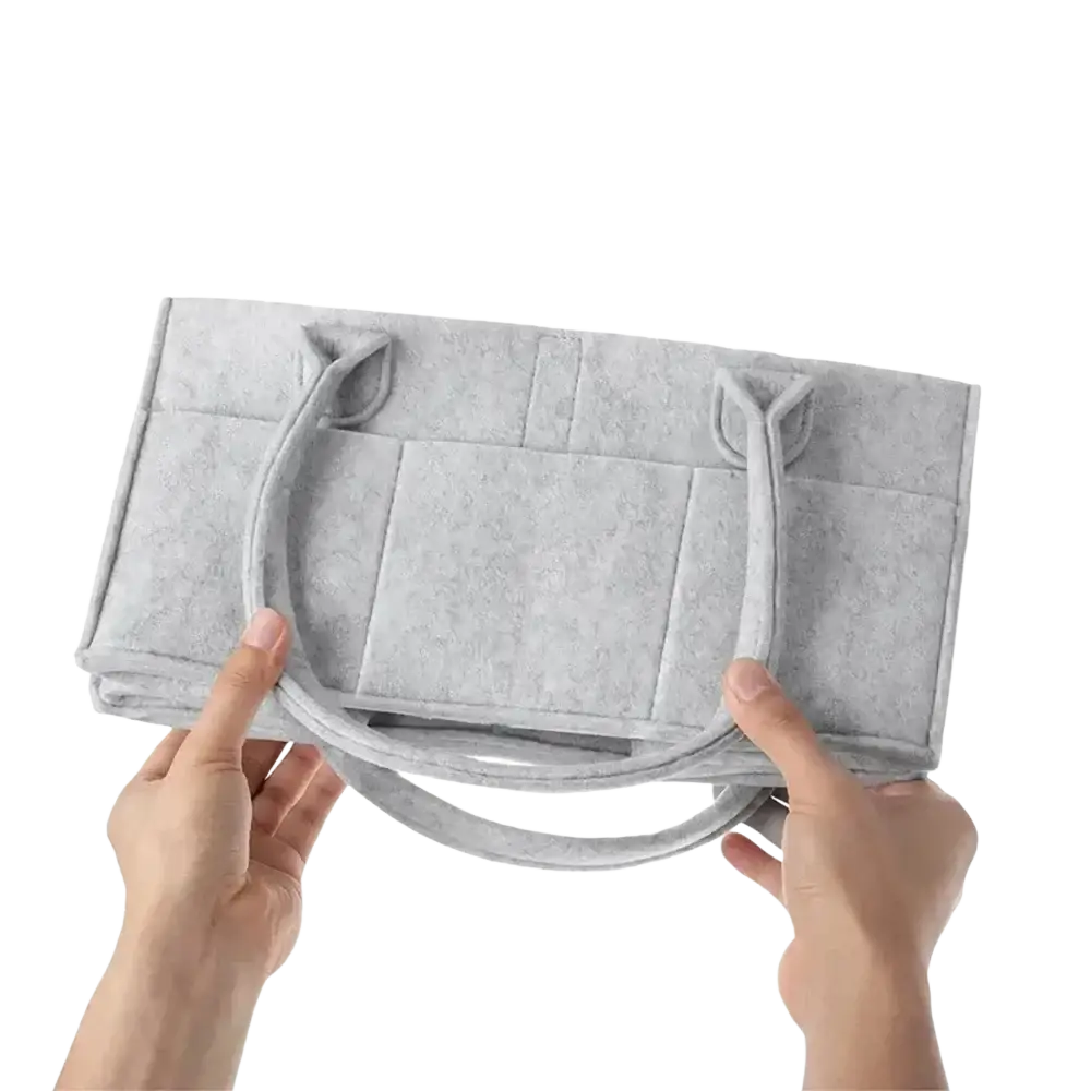 Gray felt diaper caddy organizer tote bag with two handles and a quilted design for easy storage and transport