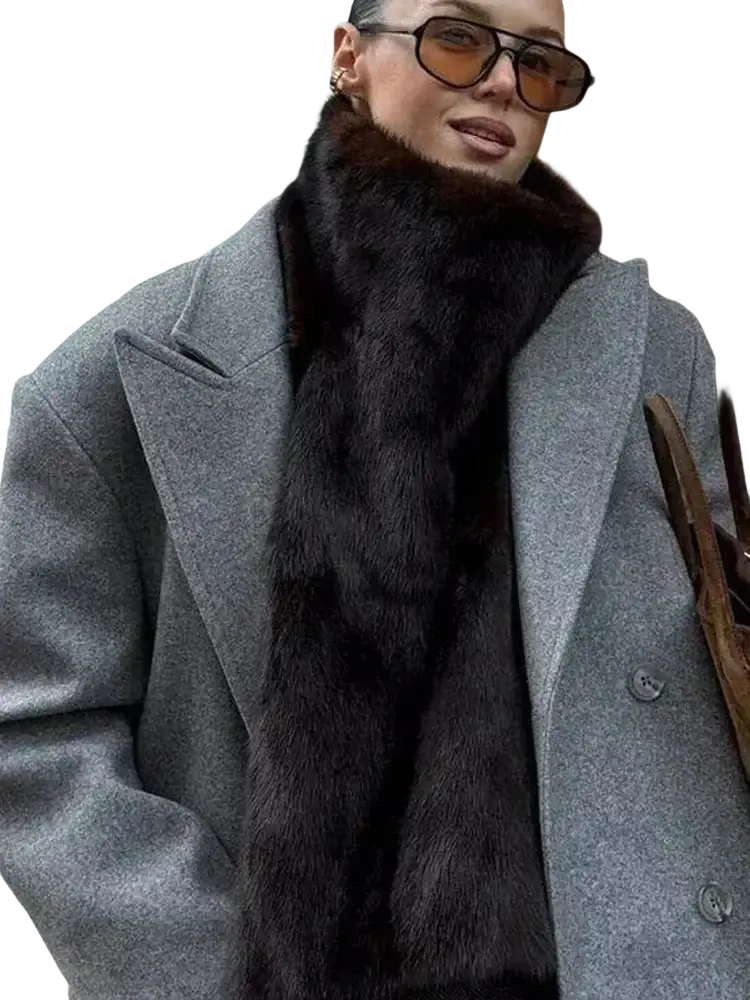 A gray fringed wool double-breasted coat paired with a plush dark brown fur scarf with a rich dense texture