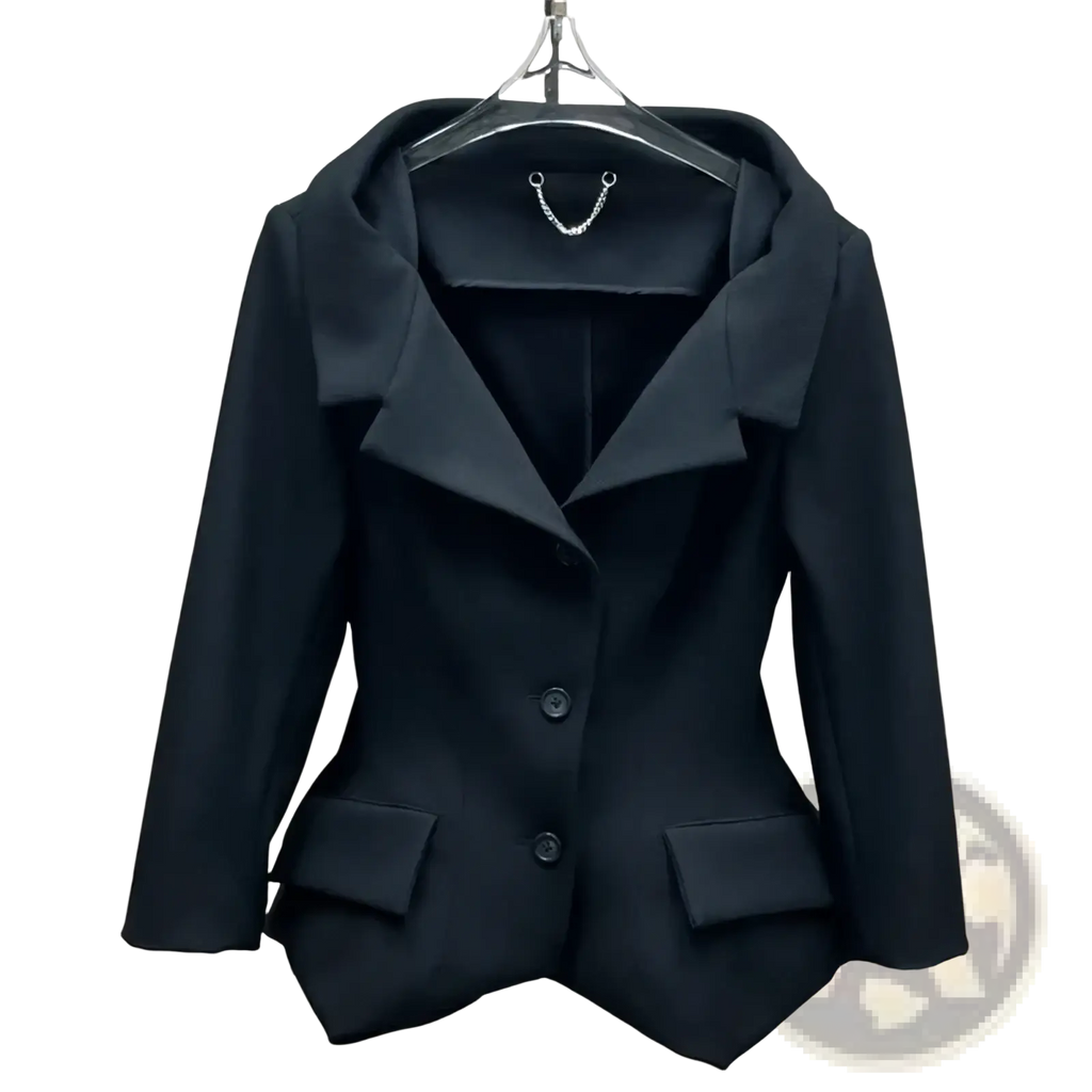 Black blazer with structured tailored fit and notched lapels paired with gray high waisted knee length pencil skirt