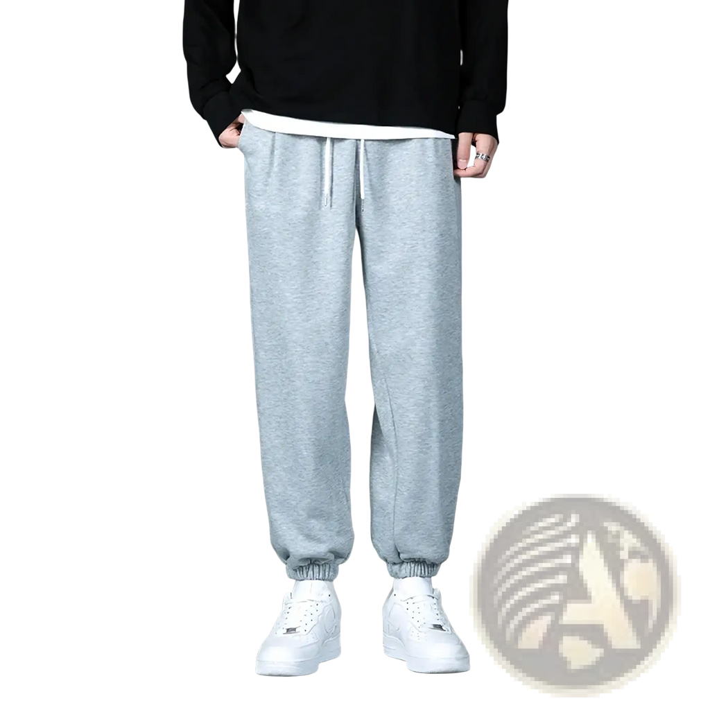 Light gray heathered mens jogger sweatpants with white drawstrings and elastic cuffs for casual wear