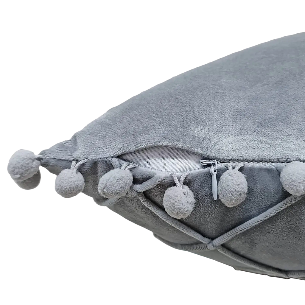 Gray velvet pillow cover with fluffy pom-poms edge and zipper closure offering positive feedback for pillow covers
