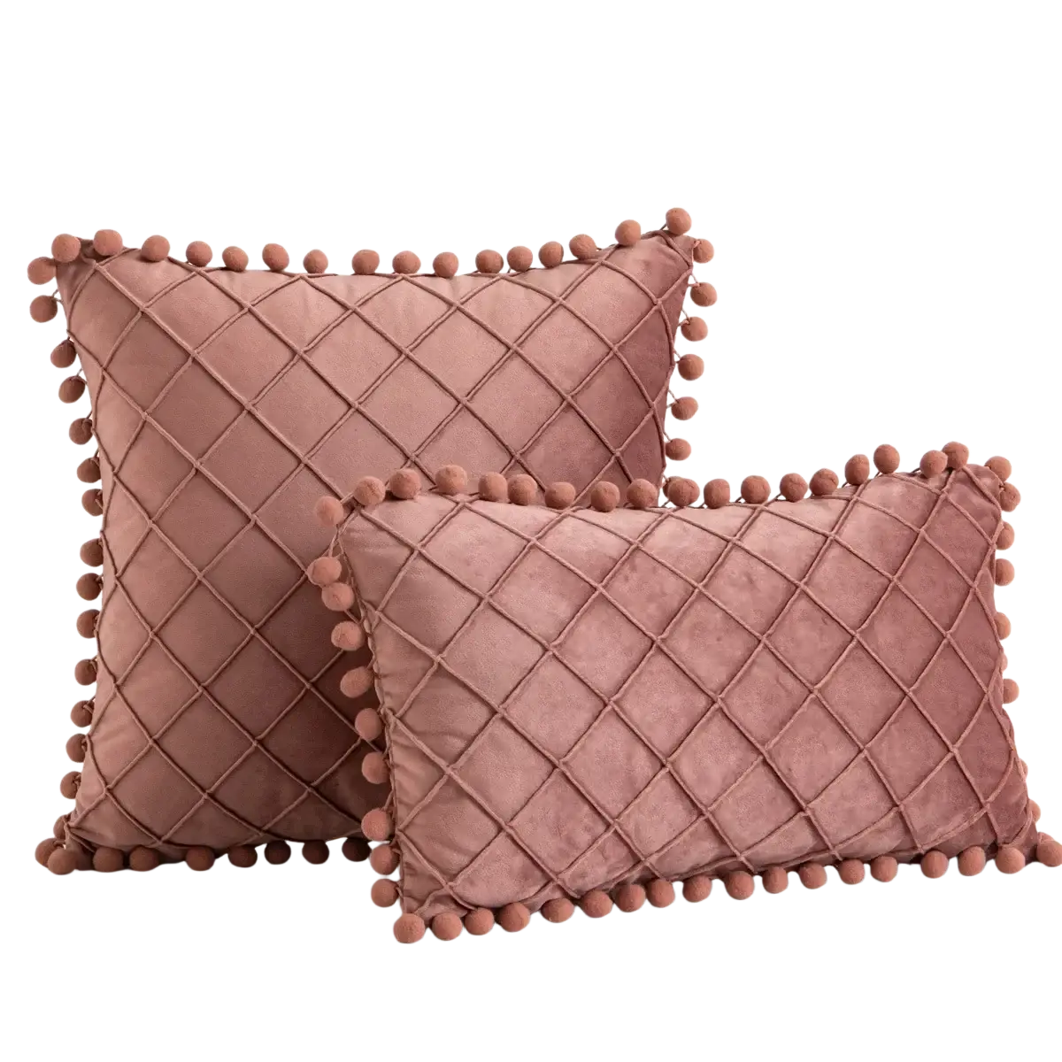 Two dusty rose velvet throw pillow covers with diamond-quilted pattern and pom-pom trim for positive feedback decor