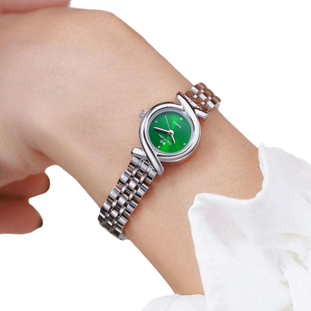 A sleek green dial luxury stainless steel quartz women watch with diamond accents and an elegant silver-toned bracelet