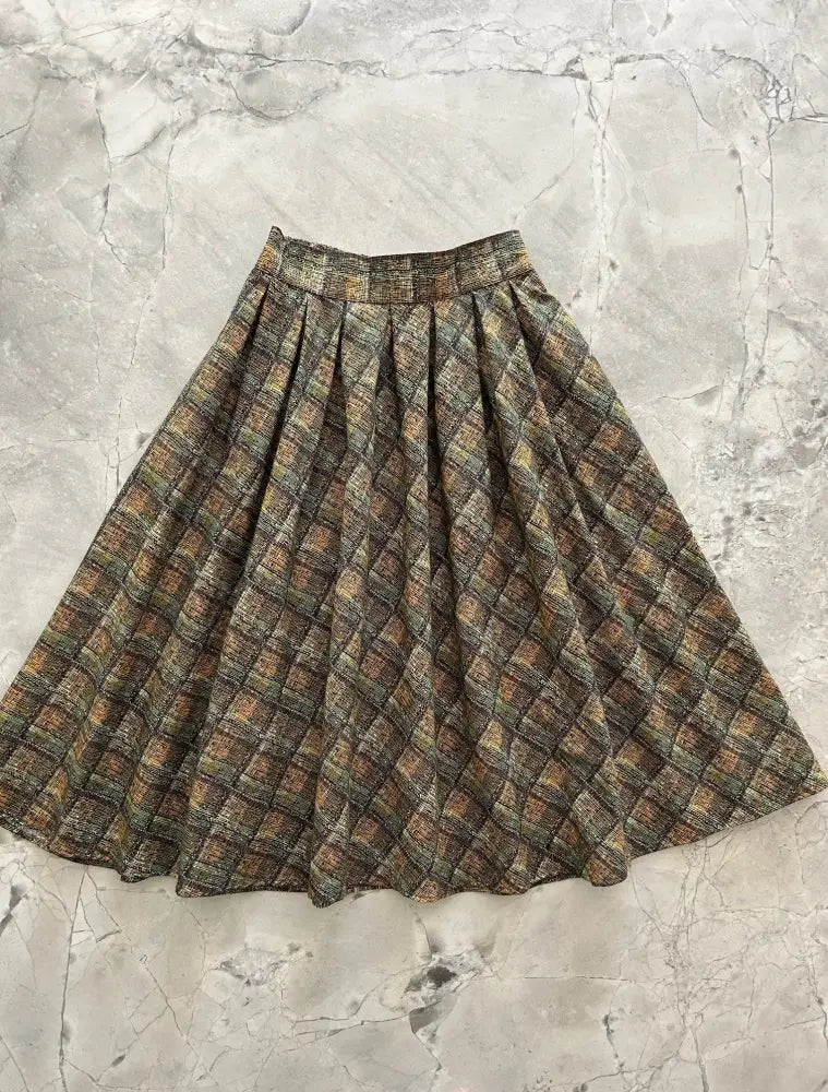 Green plaid doris vintage cotton midi skirt with pockets featuring a flared earth toned textured plaid pattern