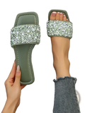 Olive green slide sandals with a sparkling band of clear rhinestones and white pearls flat style