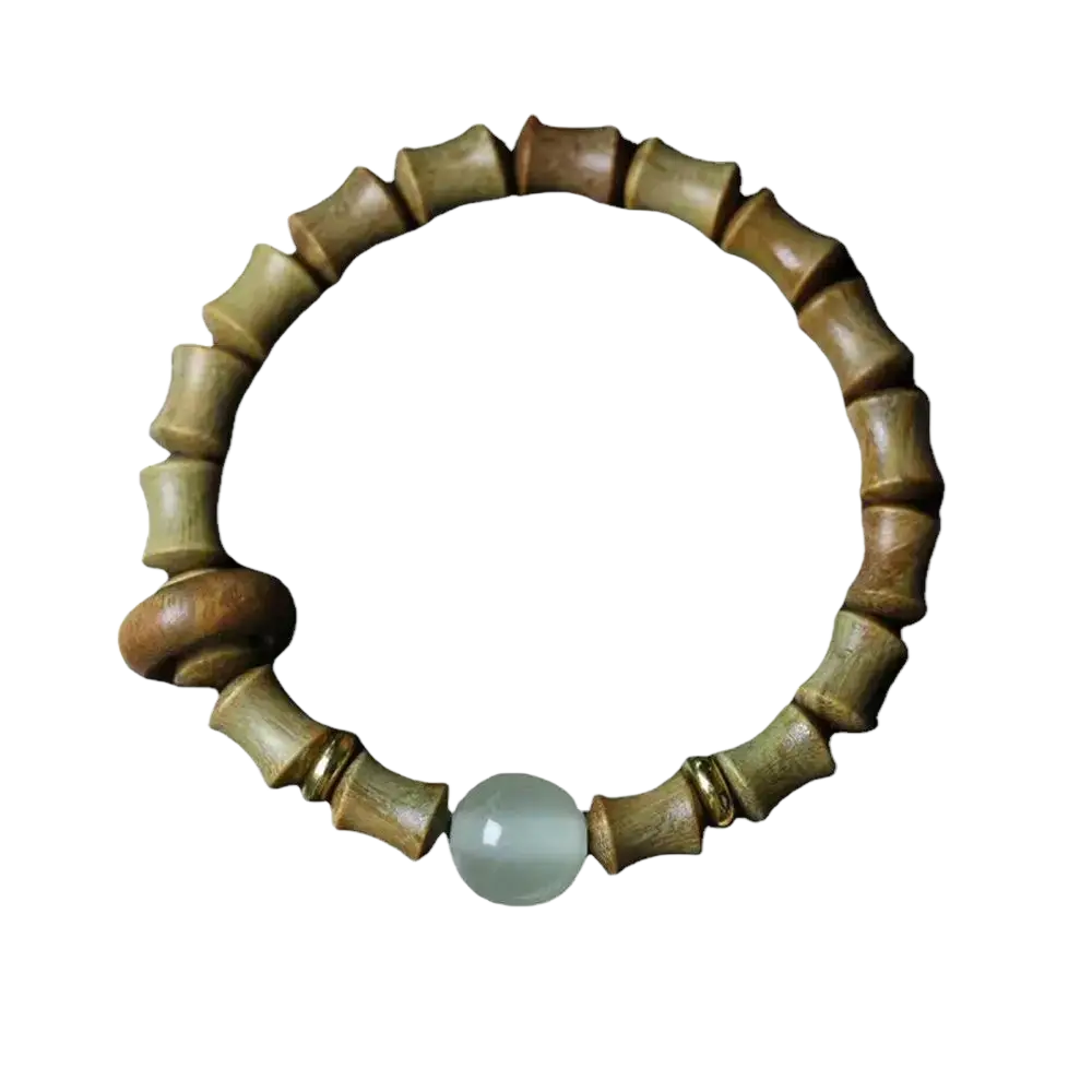 A green sandalwood hand bracelet featuring a bamboo-patterned wooden band with a single light green jade bead
