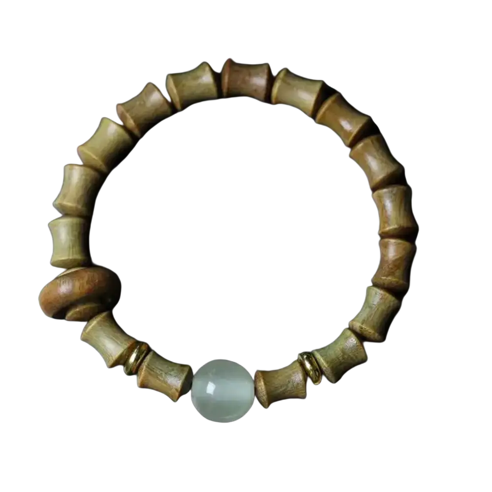 A handcrafted green sandalwood hand bracelet featuring a light green jade bead and gold-toned spacers