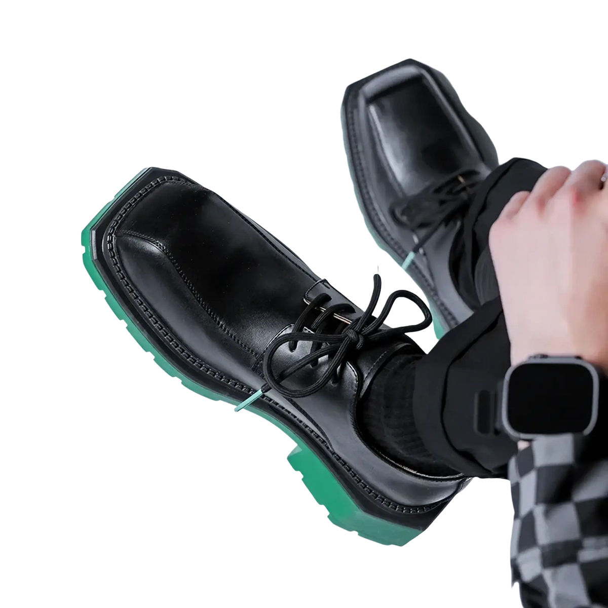Black leather casual lace-up shoes with a bold green rubber sole for stylish everyday wear