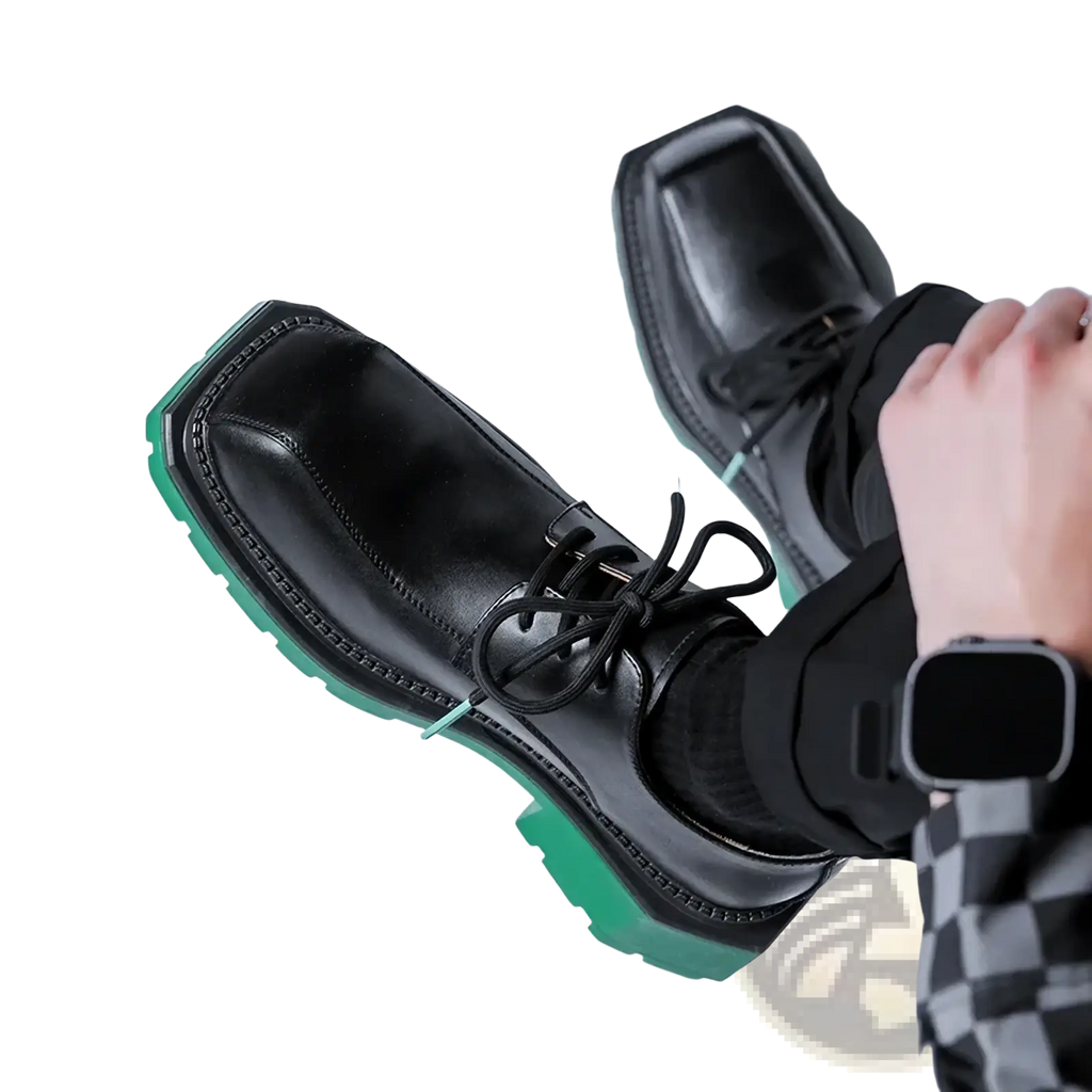 Black leather casual lace-up shoes with a bold green rubber sole for stylish everyday wear