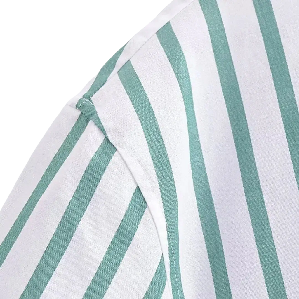 A close-up of a green striped short sleeve crop shirt with vertical white and mint green stripes and stitched seams