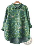 Green woodland print long sleeve shirt made of linen featuring a green base with blue and beige deer bird and floral patterns