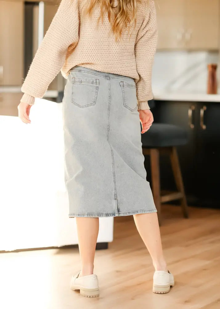 Greta light wash button front denim midi skirt showing back side with classic back pocket design in light-wash denim