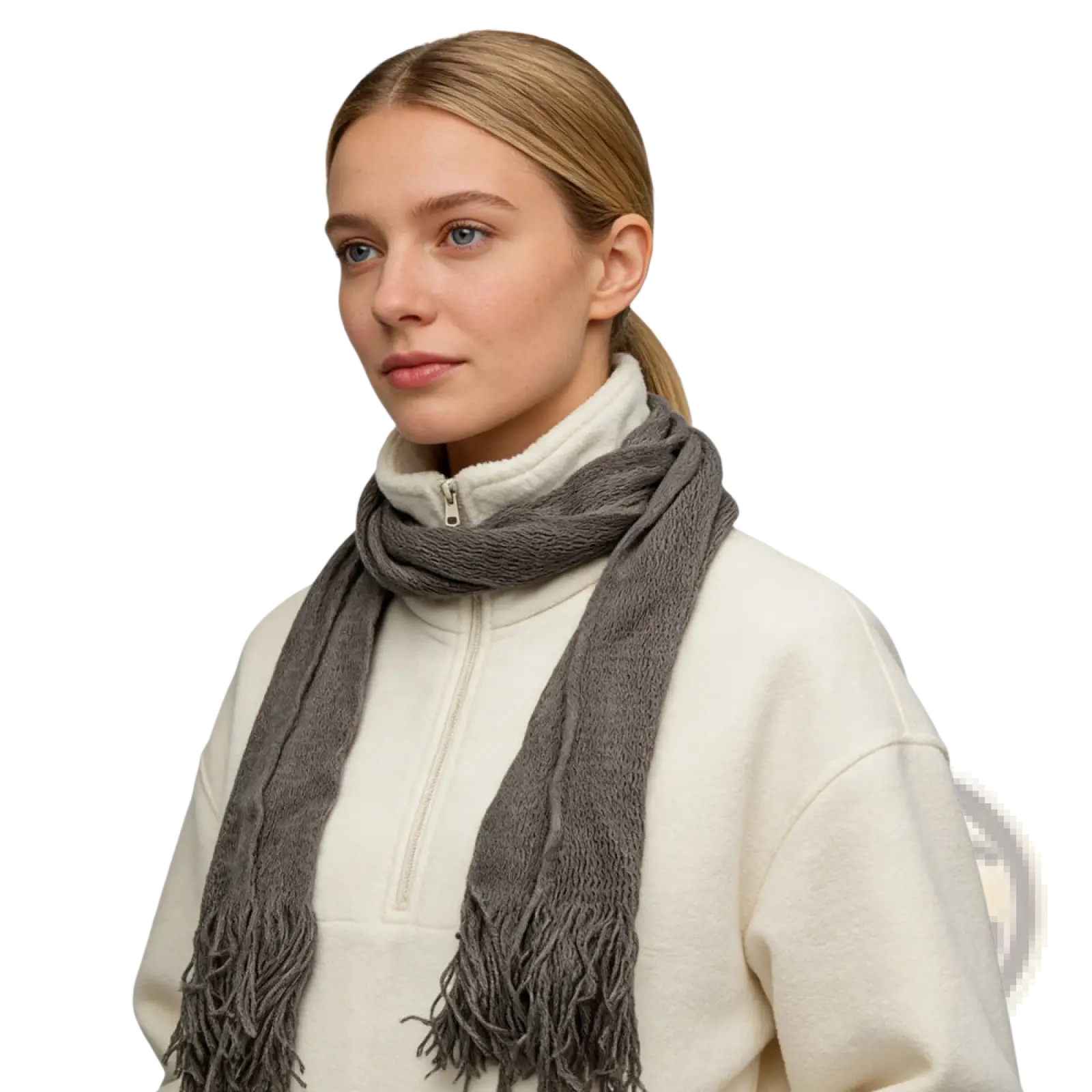 A soft textured gray acrylic skinny scarf with fringed ends worn as a lightweight winter accessory
