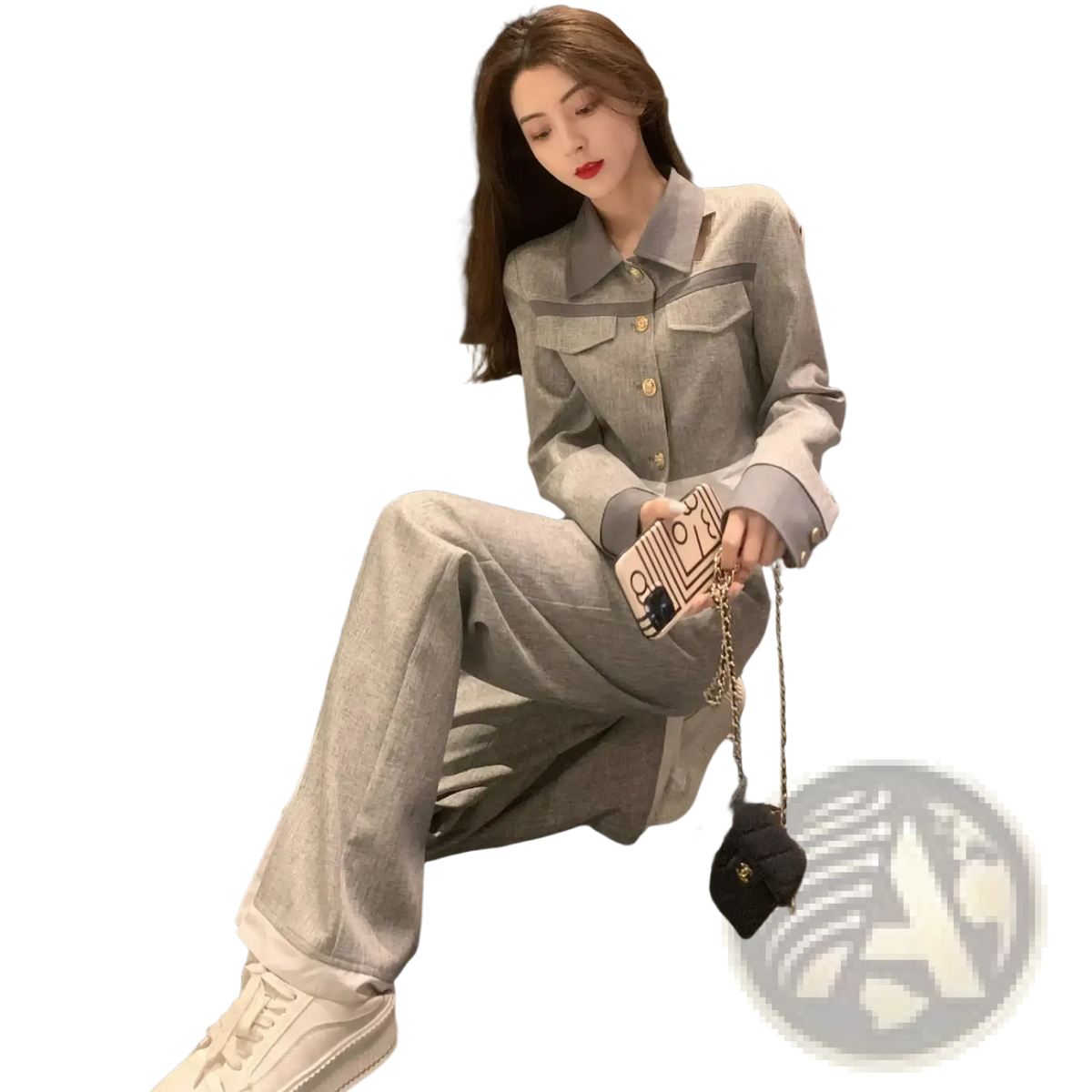 A beige phone case with a black cat design and gold chain strap complements the grey denim two piece suit wide leg pants