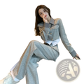 Grey denim two piece suit featuring a tailored grey denim jacket with white accents and gold tone buttons