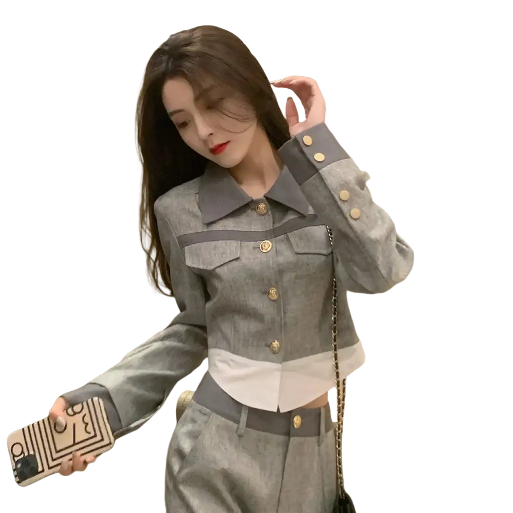 Gray and white two-tone denim jacket with gold-toned buttons as part of grey denim two piece suit wide leg pants