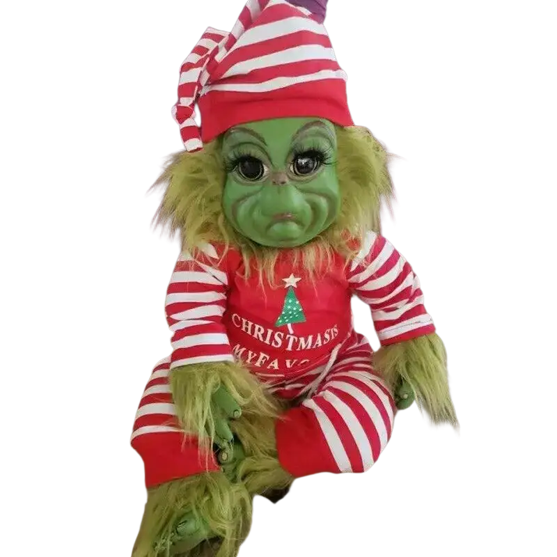 Green plush grinch stuffed toy wearing red and white striped onesie with christmas my fave print for holiday decor