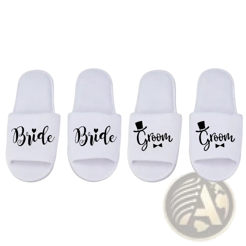 White slip-on groom slide slippers with black cursive text bride and groom featuring heart and top hat graphics for weddings