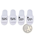 White slip-on groom slide slippers with black cursive text bride and groom featuring heart and top hat graphics for weddings