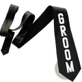 Black satin groom sash with bold white lettering from the groom tie and sash wedding set